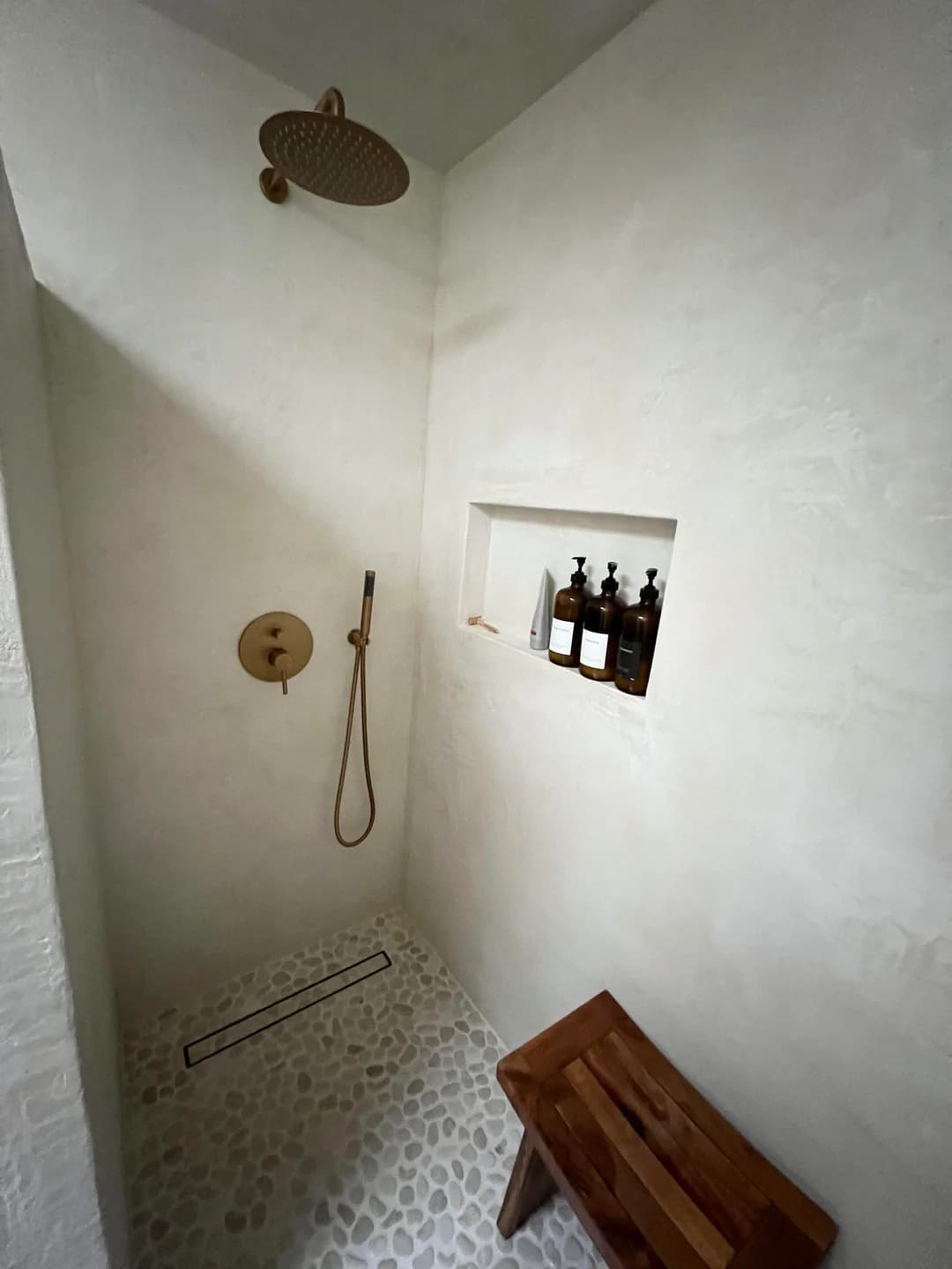 Microcement bathroom with seamless shower finish